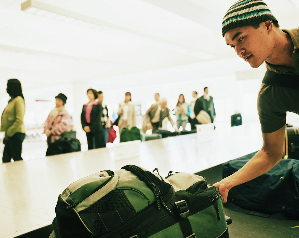 Taking luggage off the carousel
