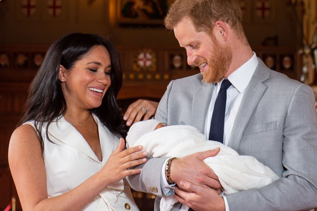 Meghan Markle and Prince Harry laughing with Archie|Dominic Lipinski / AFP/Getty Images