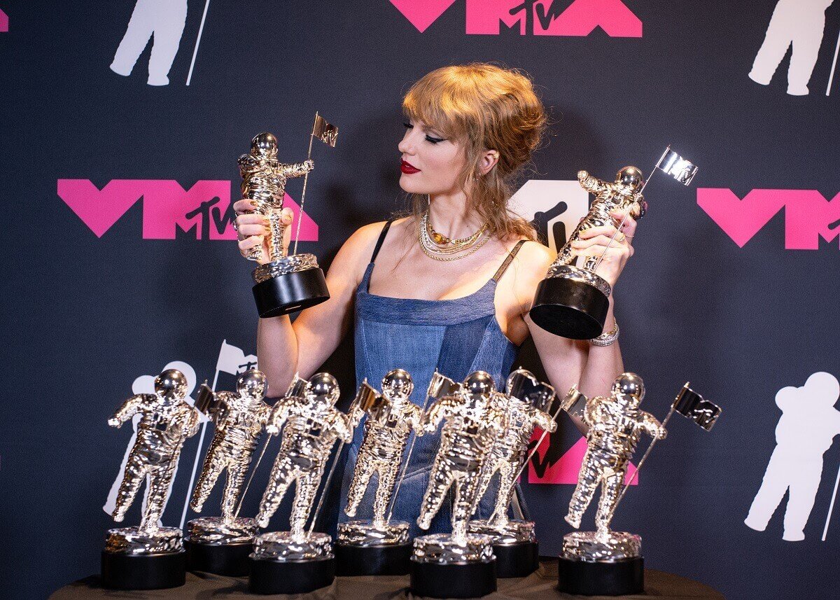 Taylor Swift photographed backstage during the 2023 Video Music Awards with several Moonmen award statues
