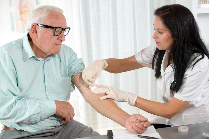 Nurse drawing blood