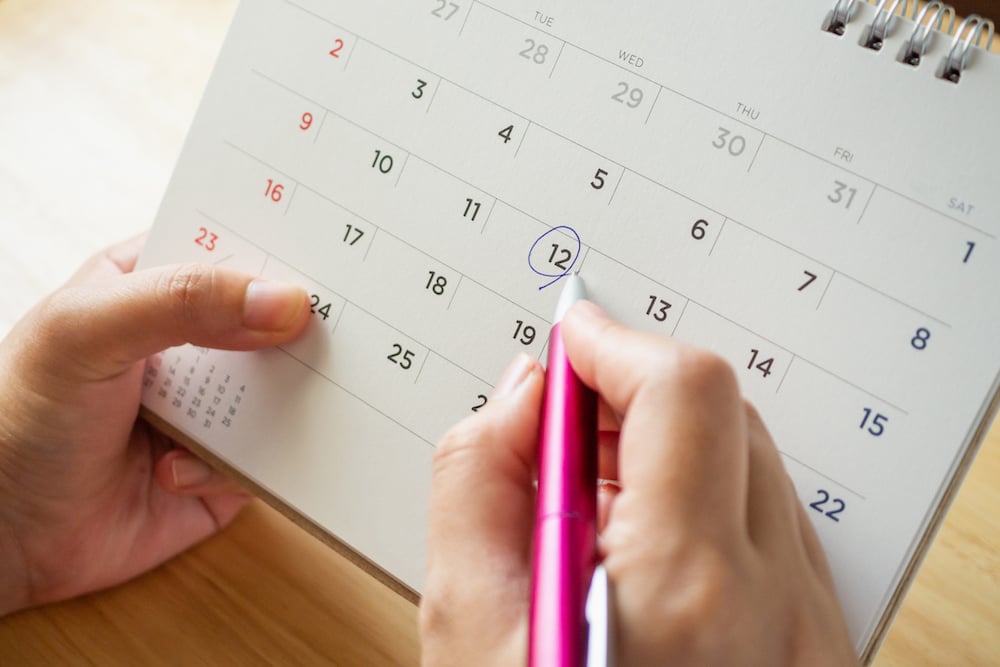 Hands holding a calendar