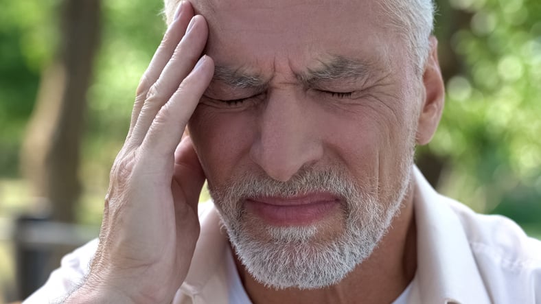 Man holding head