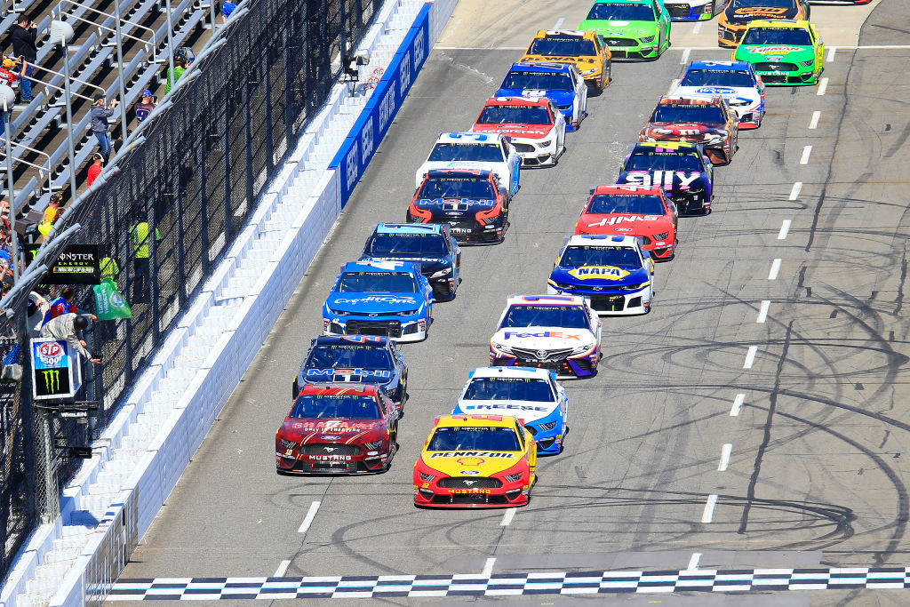 NASCAR cars lined up at the starting line