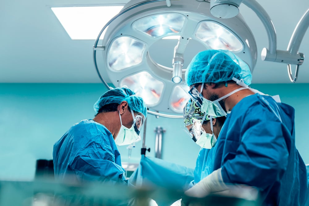 Surgeons operating on a patient