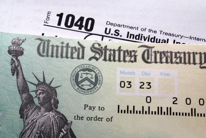 Close up of tax return check sitting on 1040 form