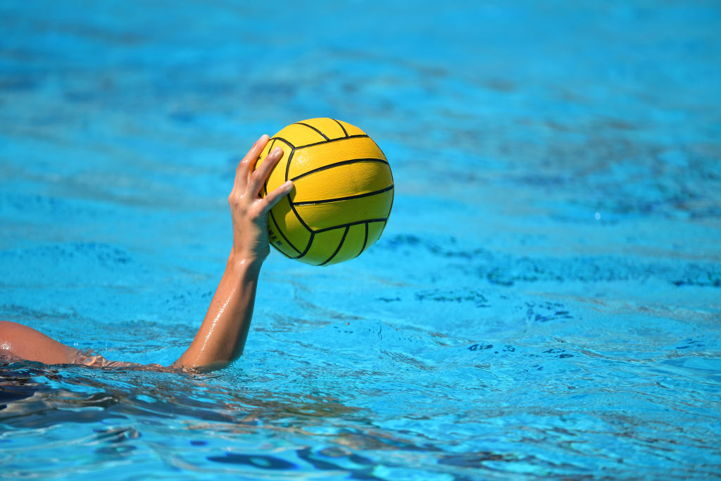 Hand holding water polo ball