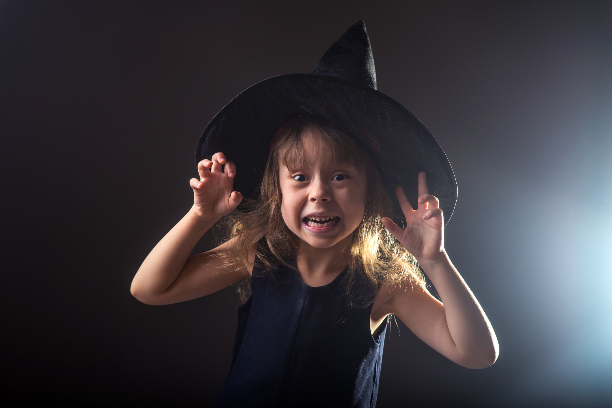 Child wearing witch outfit