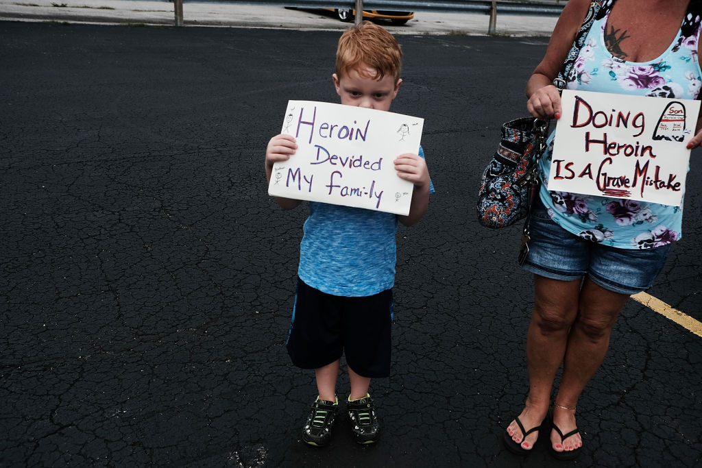 Five-year-old Derrick Slaughter attends a march against the heroin epidemic.