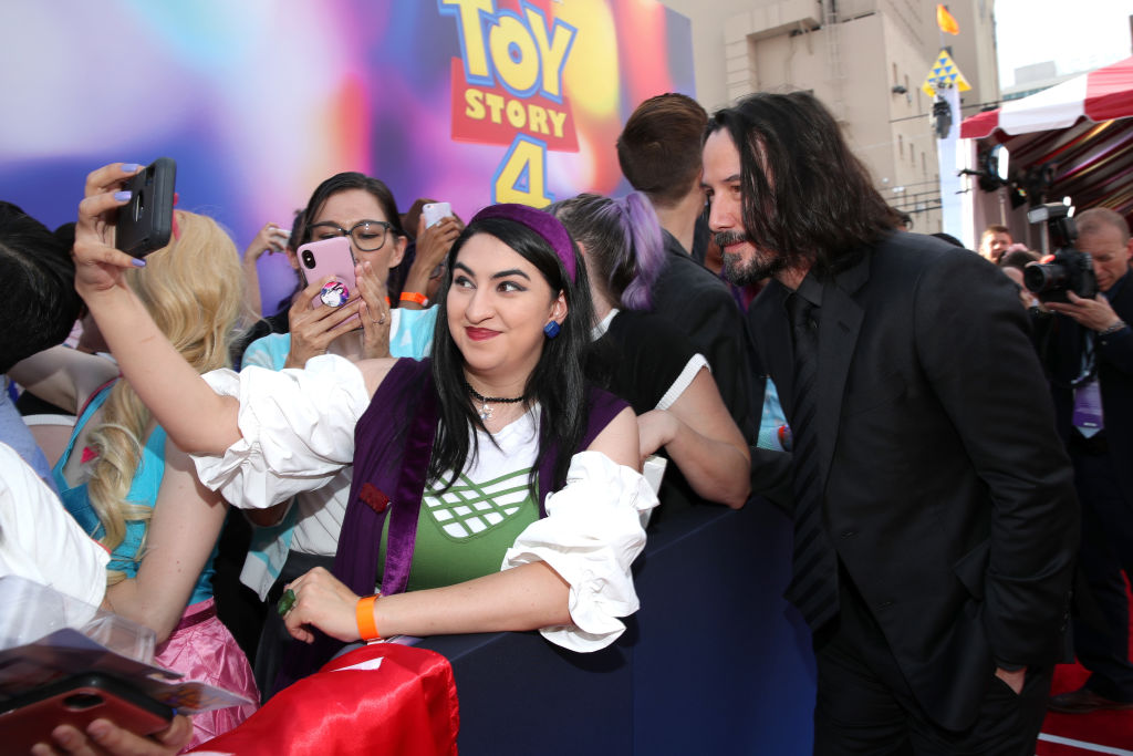 Keanu Reeves (R) attends the world premiere of Disney and Pixar's Toy Story 4