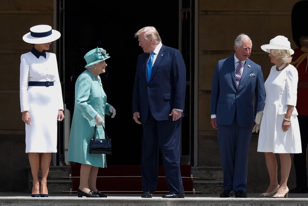 Queen Elizabeth II (2L) speaks with US President Donald Trump (C) as US First Lady Melania Trump (L) stands by with Britain's Prince Charles, Prince of Wales (2R) and Britain's Camilla, Duchess of Cornwall (R)