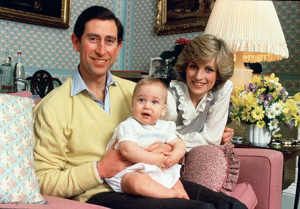 Prince Charles, Prince of Wales and Diana, Princess of Wales with their baby son, Prince William, at home in Kensington Palace