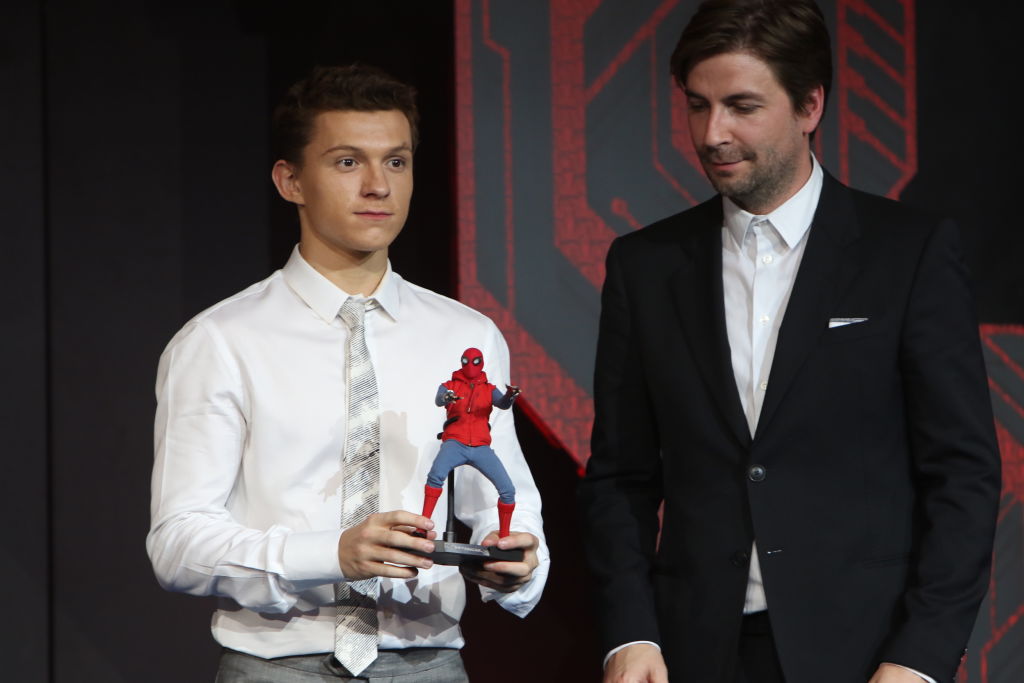 Tom Holland (L) and American director Jon Watts