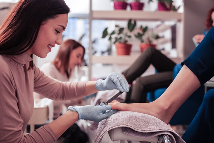 Nail specialist doing a pedicure