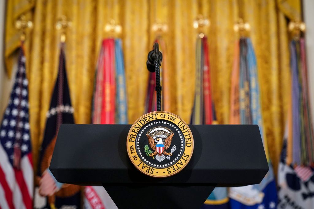The presidential seal on a podium