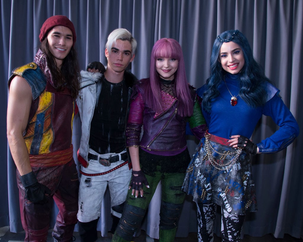 Cameron Boyce with Dove Cameron, Sofia Carson, and BooBoo Stewart on set of Descendants  | Eric McCandless/Walt Disney Television via Getty Images via Getty Images