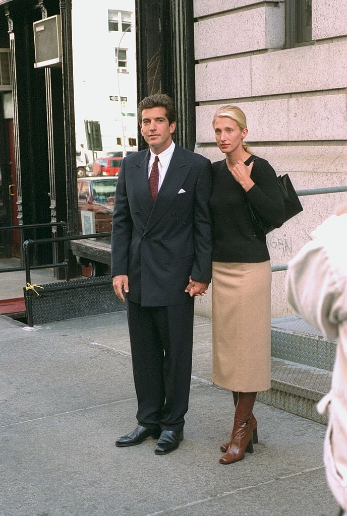 John F. Kennedy Jr. and bride Carolyn Bessette Kennedy stand in front of their apartment in Tribeca, 1996.