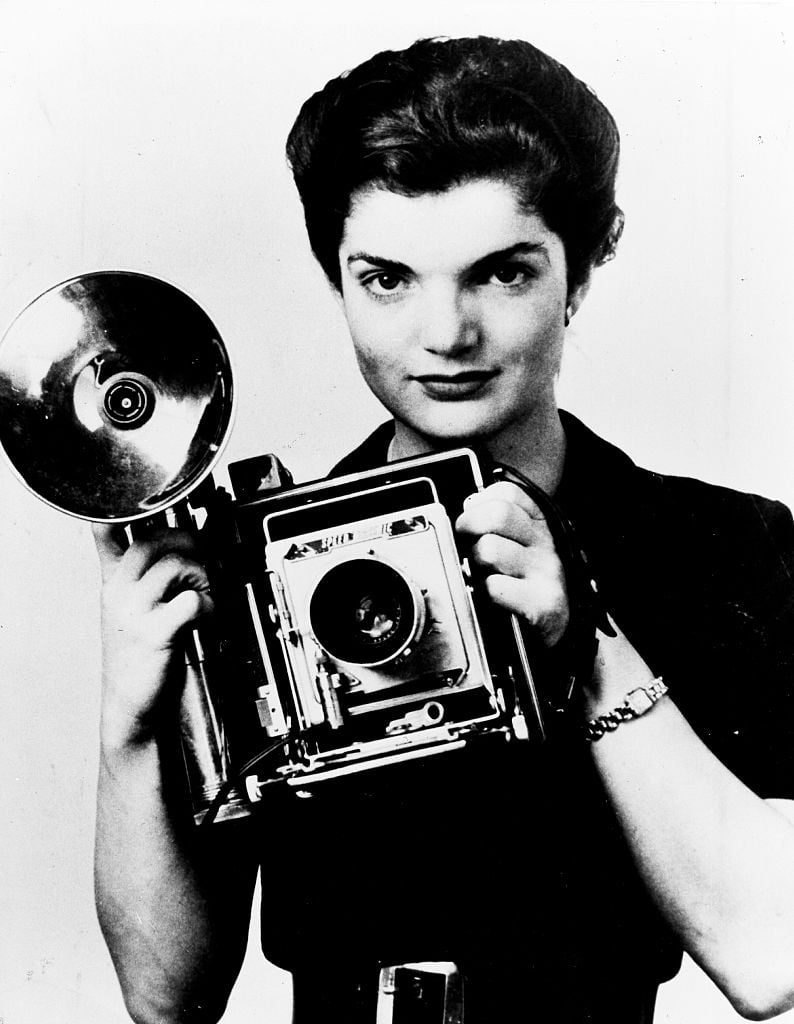 Jacqueline Bouvier Kennedy Onassis with camera