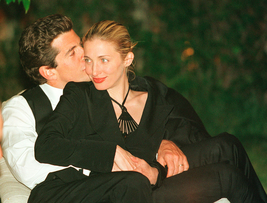 John F. Kennedy, Jr. editor of George magazine, gives his wife Carolyn Bessette Kennedy a kiss on the cheek during the annual White House Correspondents dinner May 1, 1999 in Washington, D.C. 