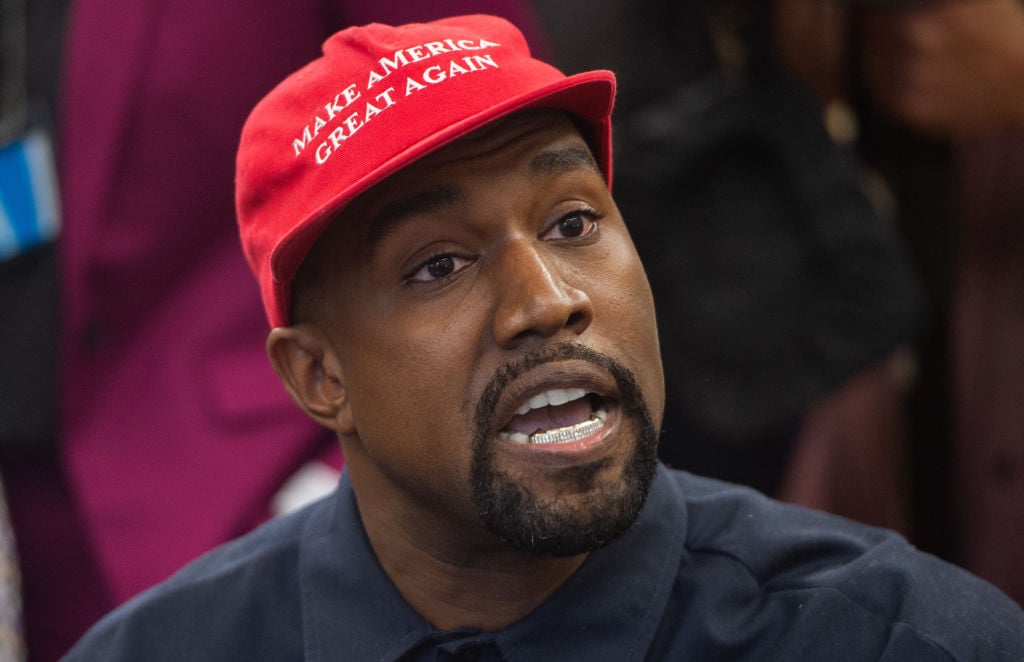 Kanye West wearing Donald Trump's hat