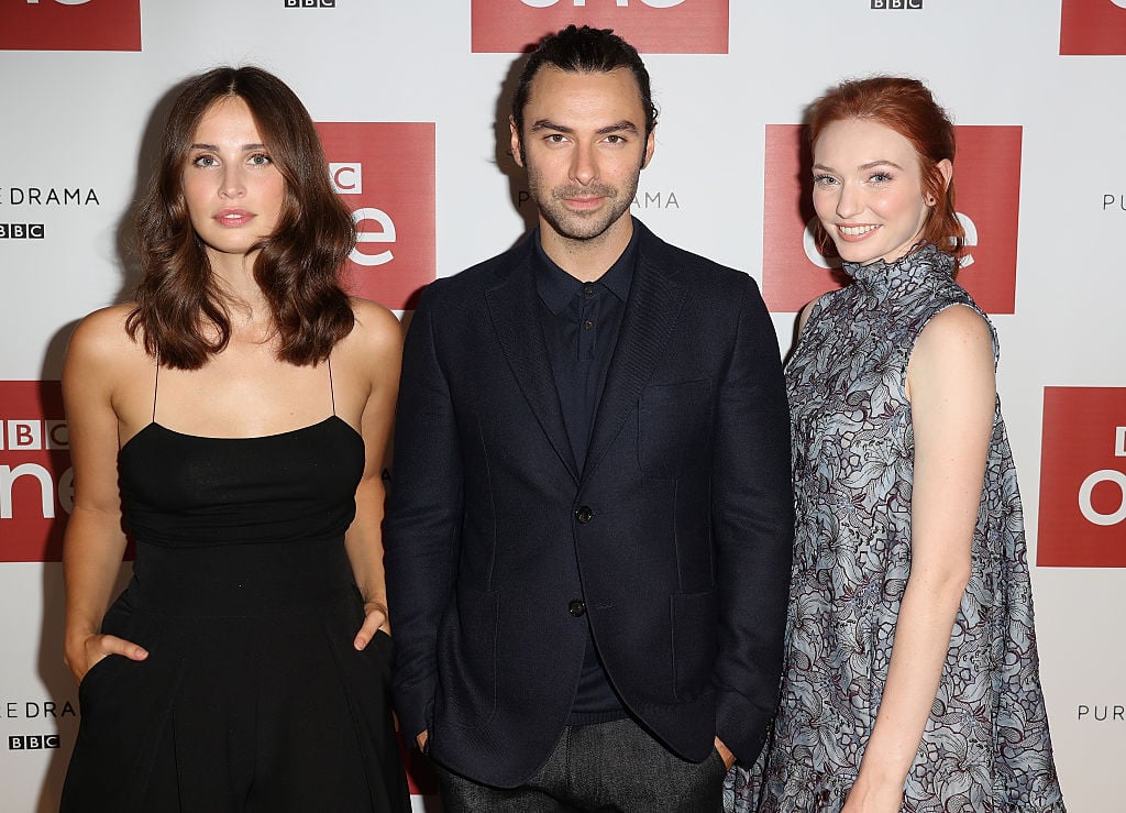 Actor Aidan Turner, actress Heida Reed and actress Eleanor Tomlinson at the Poldark Series 2 Preview Screening | Chris Jackson/Getty Images