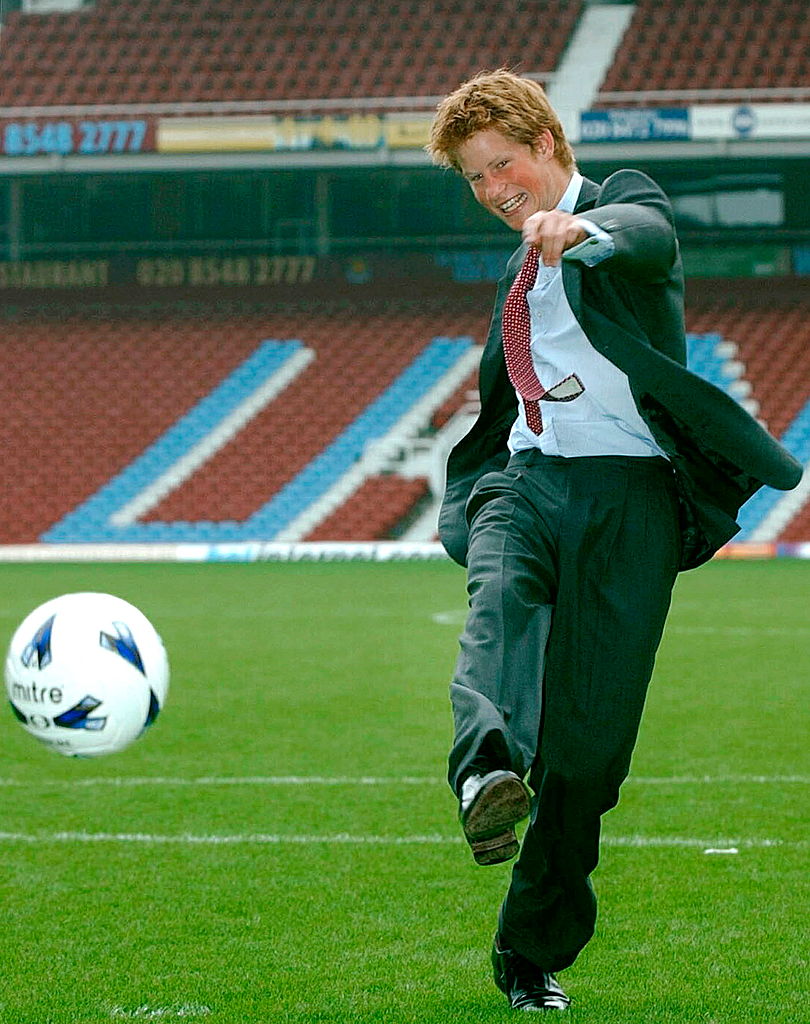 Prince Harry playing soccer in 2002.