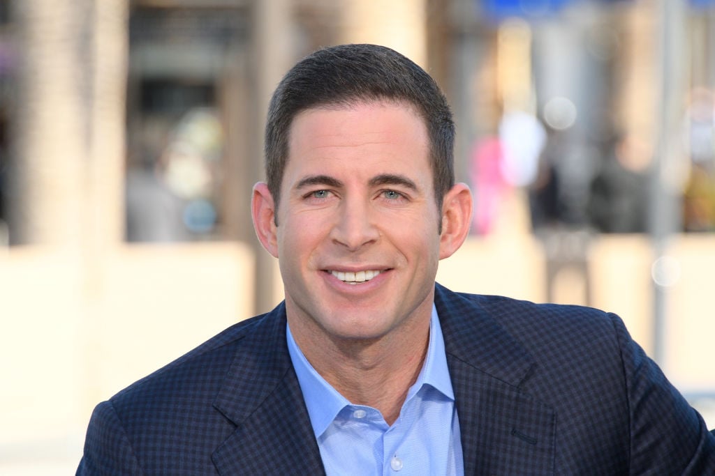 Tarek El Moussa smiling in front of blurred background