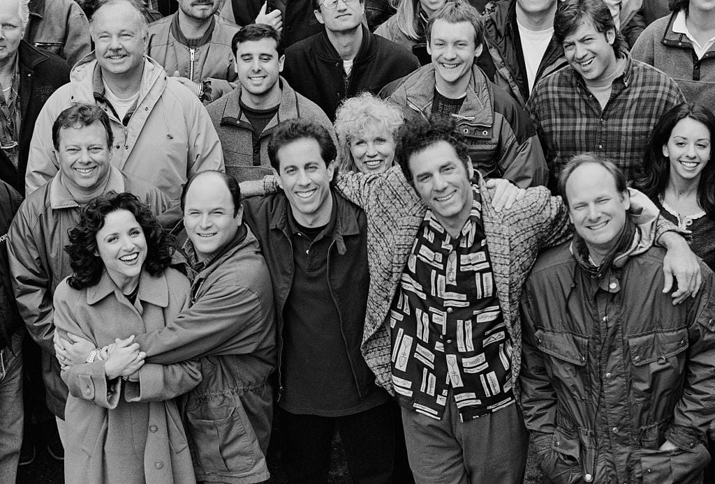 The cast and crew of the hit television show "Seinfeld" pose on set during the last days of filming the final episode, April 3, 1998 in Studio City, California.. From left to right in the front row are actors Julia Louis-Dreyfus (Elaine), Jason Alexander (George), Jerry Seinfeld (Jerry), Michael Richards (Kramer), and director Andy Ackerman.
