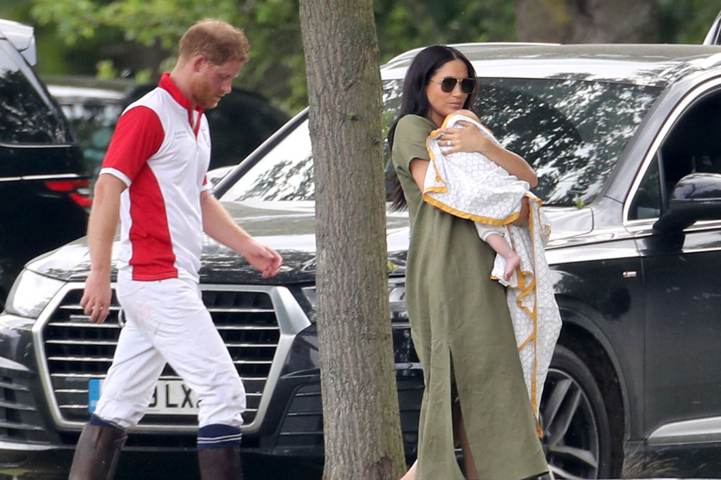 Meghan Markle holding baby Archie with Prince Harry at Polo Day.