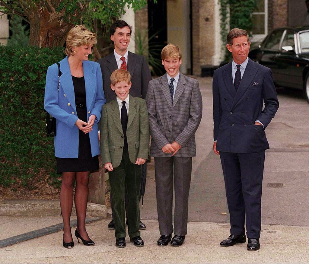 Who is Prince Harry's real father? Pictured here is Harry with his mother, brother, and father, Prince Charles.