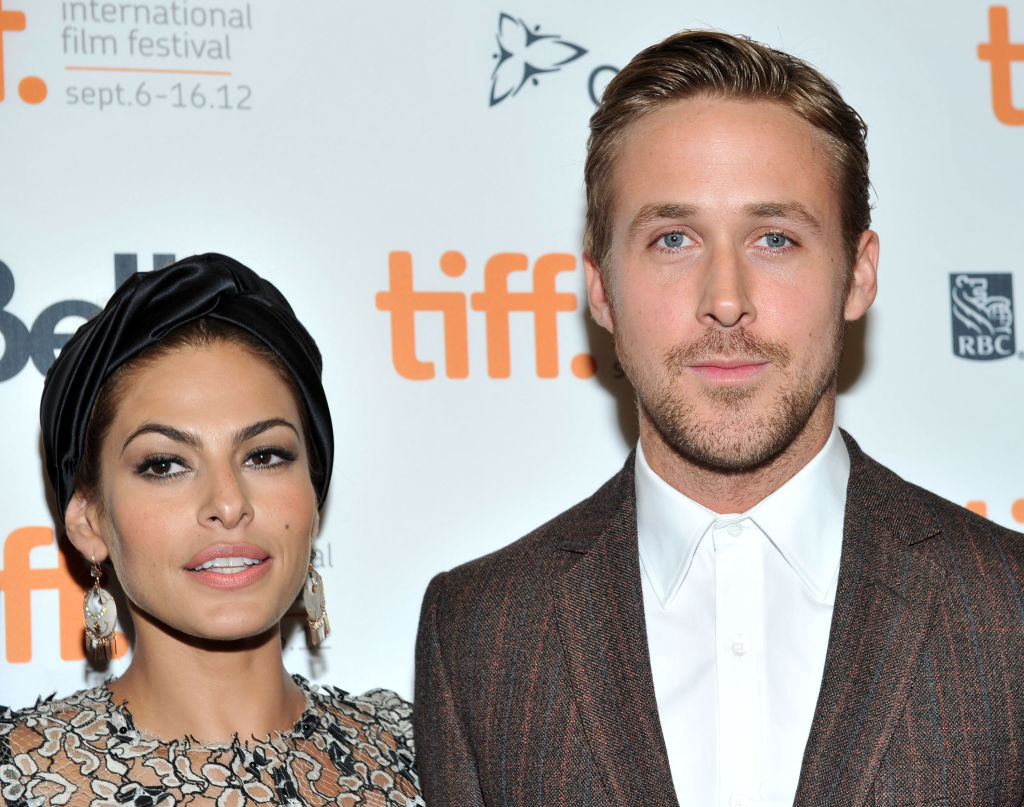 (L) Eva Mendes and (R) Ryan Gosling attend a red carpet premiere