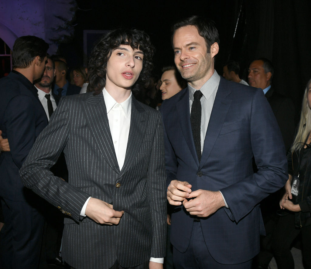 Finn Wolfhard and Bill Hader stand together