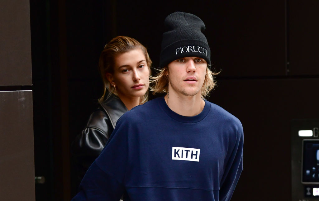 Justin Bieber and Hailey Baldwin walking outside