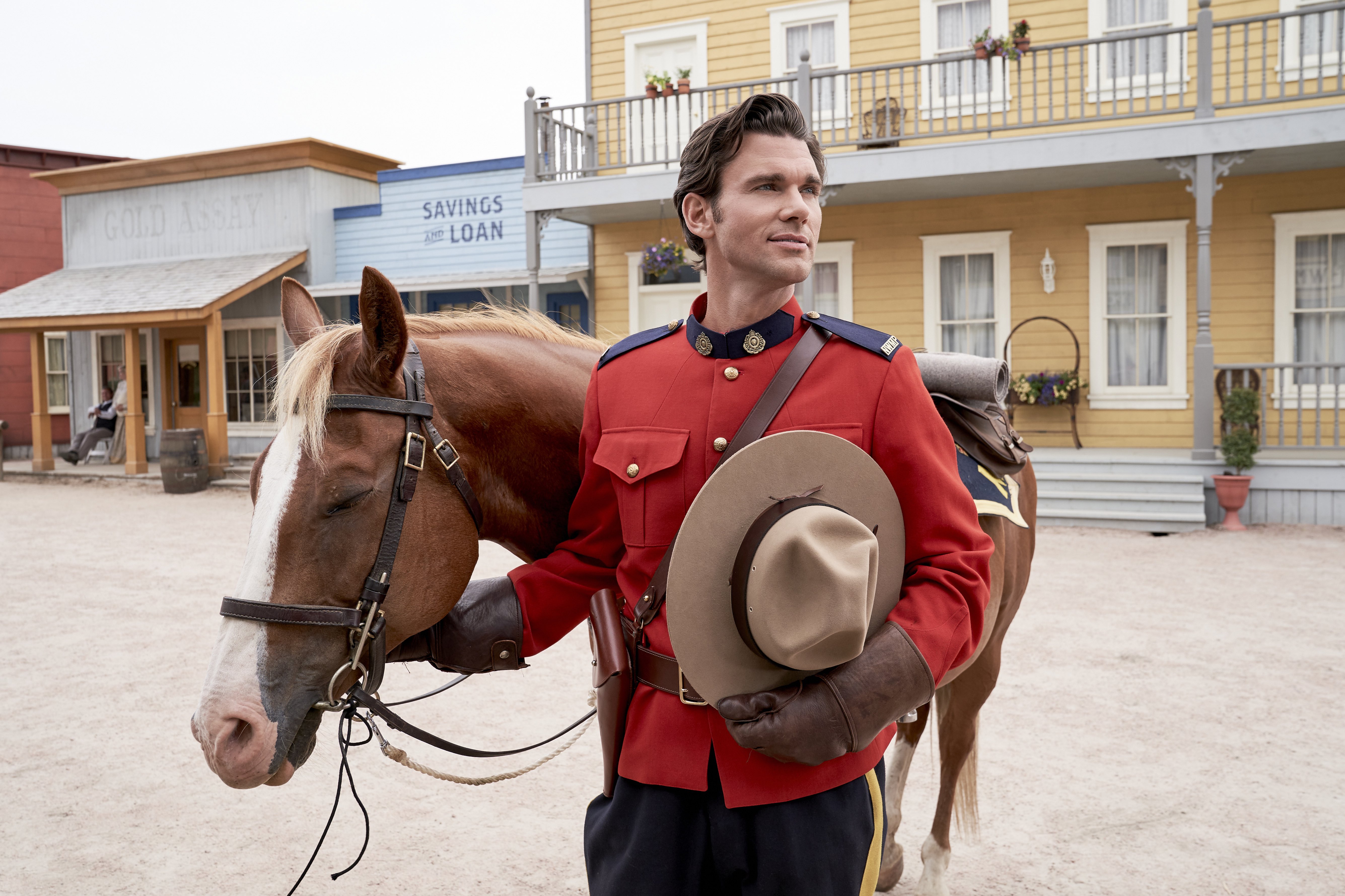 Nathan Grant standing by a horse