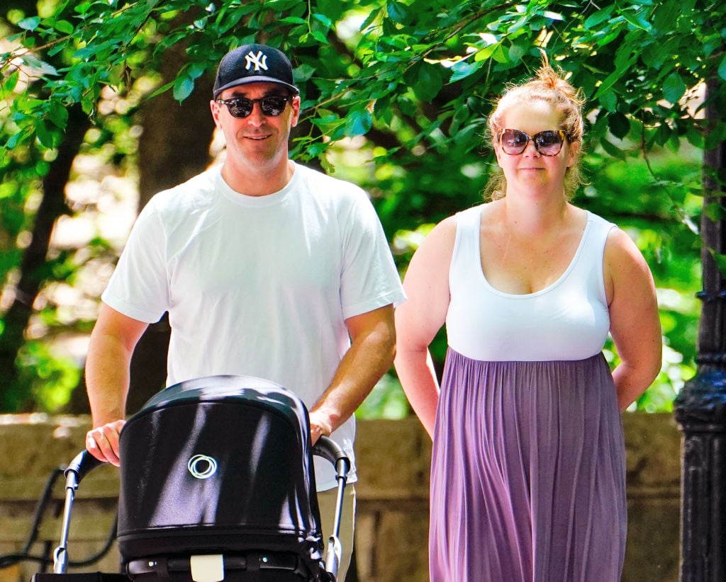 Amy Schumer and husband walking in Central Park with son