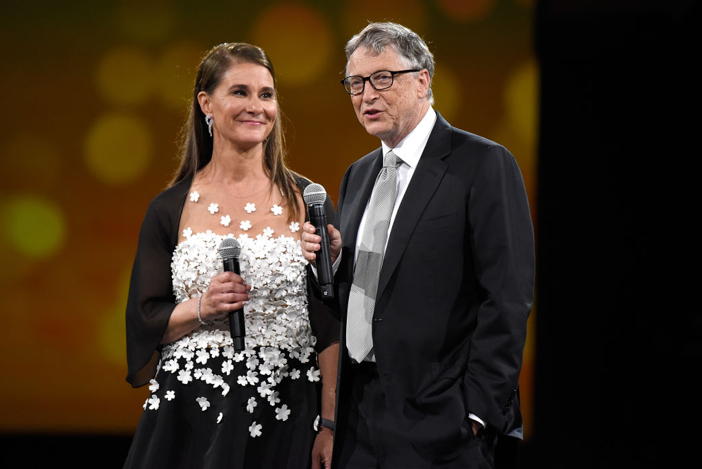 Melinda Gates and Bill Gates speaking on stage