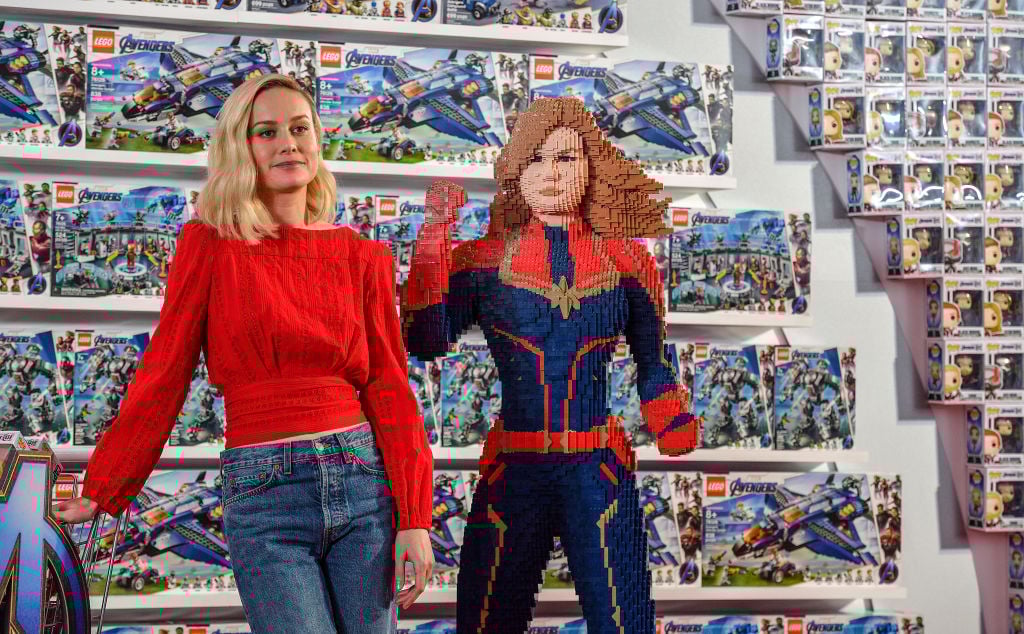Brie Larson with a Lego Captain Marvel.