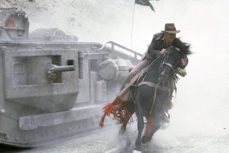 Harrison Ford riding a horse as Indiana Jones