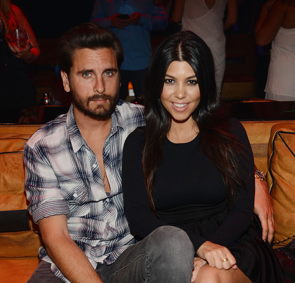 Scott Disick and Kourtney Kardashian at a party