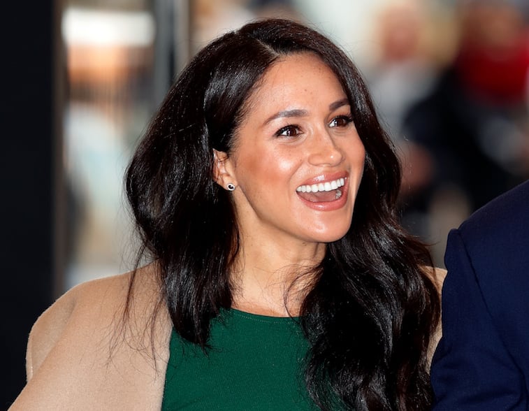 Meghan Markle smiling for the camera