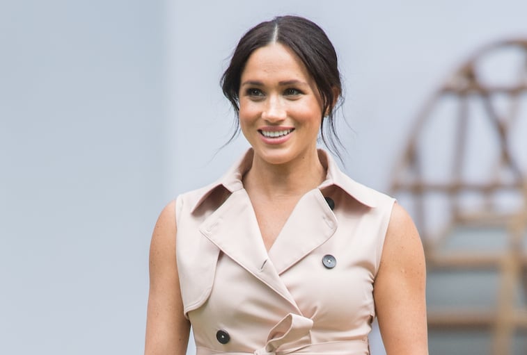Meghan Markle smiling at the camera
