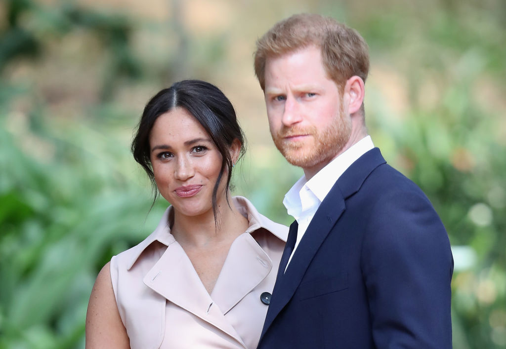 (L) Meghan Markle and (R) Prince Harry during a visit to Johannesburg