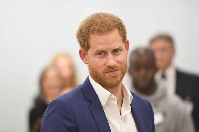 Prince Harry dressed in a suit at a royal event