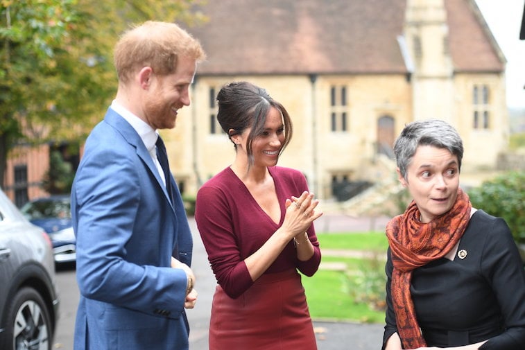 Prince Harry and Meghan Markle attain at an occasion