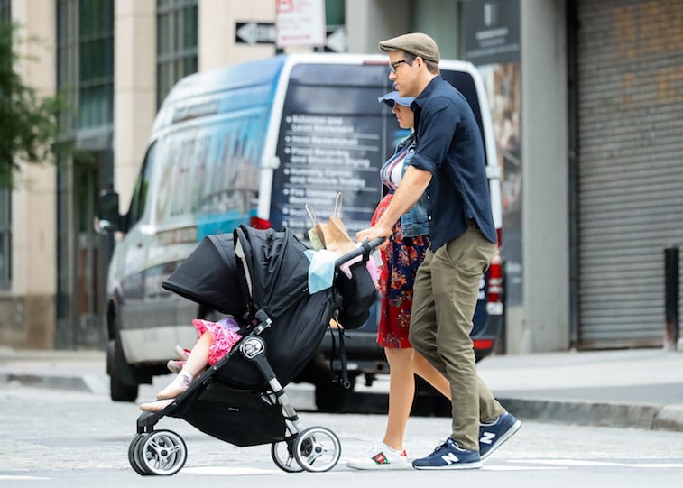 Ryan Reynolds walking with his wife and kids