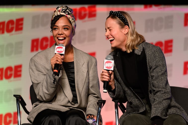Tessa Thompson and Brie Larson speaking onstage