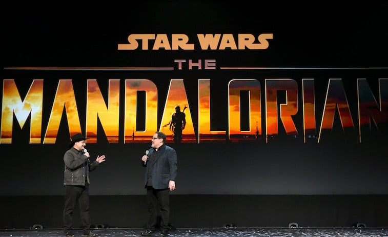 Dave Filoni and Jon Favreau talking onstage about The Mandalorian