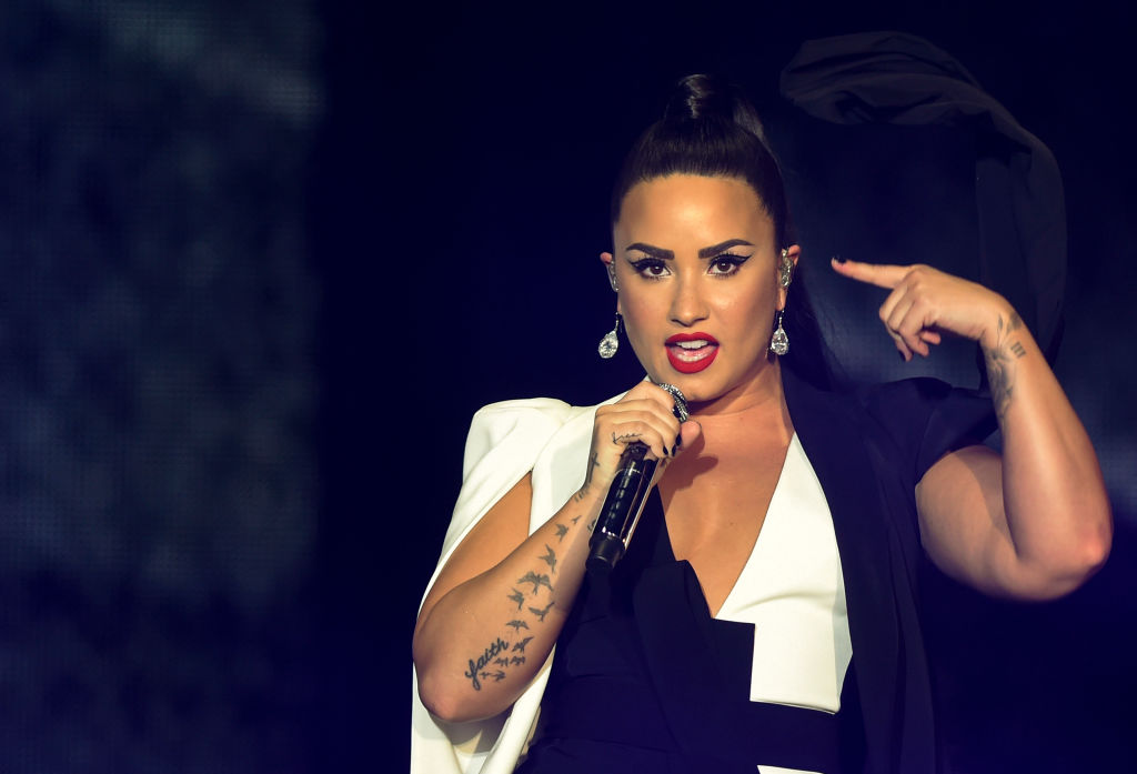 Demi Lovato wearing a black and white outfit