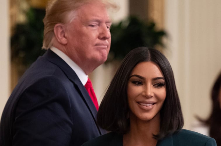 Kim Kardashian and Donald Trump in the background