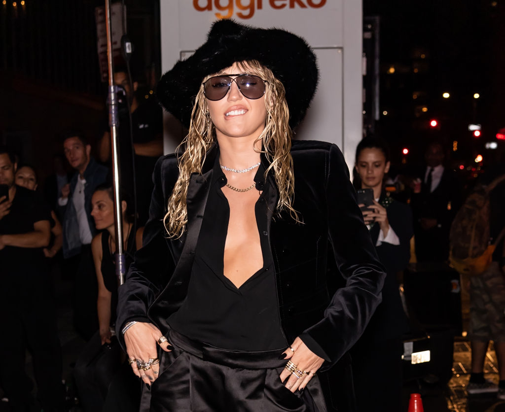 Miley Cyrus on a red carpet.