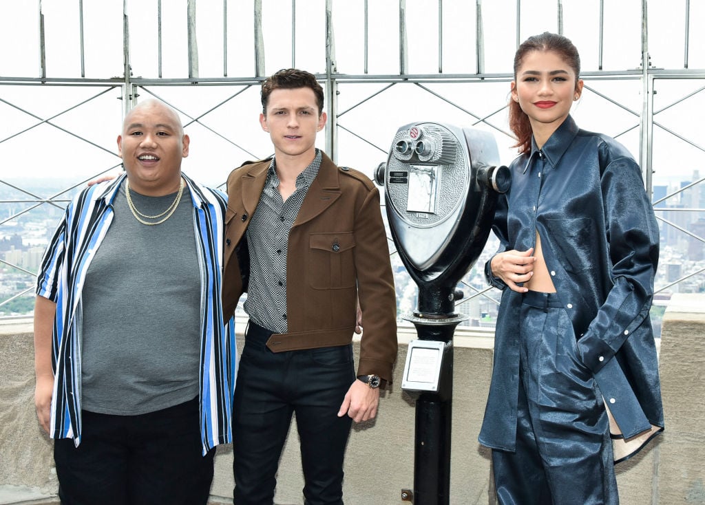 Jacob Batalon, Tom Holland, and Zendaya attend an event at the Empire State Building.